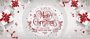 Red Christmas and New Year Text on Xmas background with gift boxes, fir branches, red ribbon, decoration, sparkles,confetti, bokeh