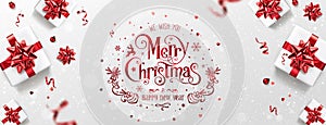 Red Christmas and New Year Text on Xmas background with gift boxes, red ribbon, decoration, sparkles, confetti, bokeh.