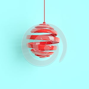 Red Christmas ornament on blue background