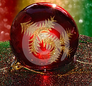 Red Christmas Ornament Floating on Glitter