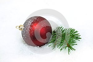Red Christmas Ornament In The Snow