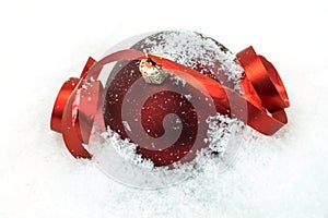 Red Christmas Ornament In The Snow