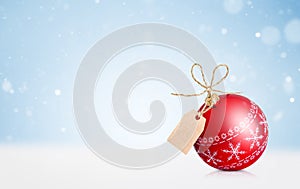 red christmas ornament with tag