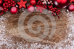 Red Christmas ornament top border with snow frame on wood