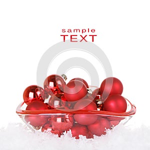 Red Christmas Ornaments In Glass Bowl With Snow