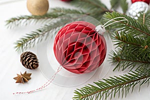 Red Christmas paper ball isolated on white background photo