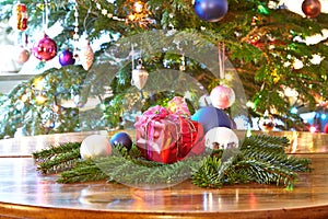 Red christmas present and baubles, Christmas tree