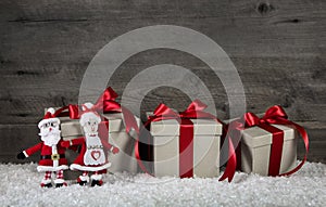 Red christmas presents on wooden grey background with mr. and mr