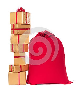 Red Christmas sack and pile of gifts, isolated on white backgrou