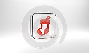 Red Christmas stocking icon isolated on grey background. Merry Christmas and Happy New Year. Glass square button. 3d