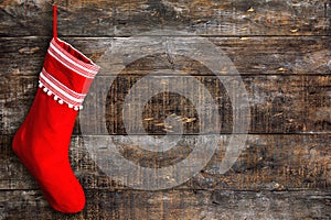 Red Christmas stocking wooden background rustic surface