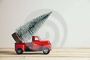 Red Christmas truck with pine tree and gift. Merry Christmas and happy new year concept