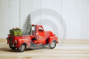 Red Christmas truck with pine tree and gift. Merry Christmas and happy new year concept