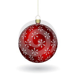 Red Christmass ball with snowflakes print hanging on a golden chain photo