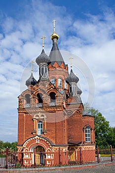 Red Church with black cupolas photo