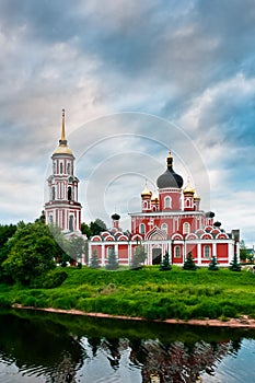 Red church on coast of the lake