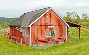 red cider mill farm building used to make cider in Fall