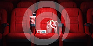 Red cinema seats and cola, popcorn and glasses in empty theater. Cinema movie theater concept background