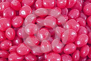 Red cinnamon hard candy closeup photo