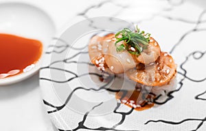 Red clam sushi or ark shell sushi or Akagai sushi serving on white plate. Japanese cuisine, a truly classic Edomae sushi-dane