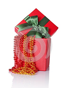 Red classic gift box with green satin bow and beads