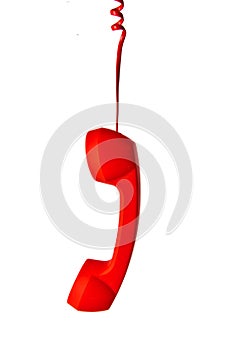 Red classic telephone receiver on white background