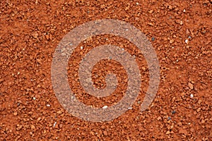 Red clay court tennis background texture. Tennis court close-up of gravel surface