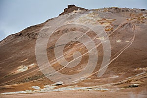 Red clay hill in the geothermal area Hverir, Iceland in summer. Myvatn region, North part of Iceland