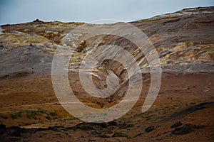 Red clay hill in the geothermal area Hverir, Iceland in summer. Myvatn region, North part of Iceland