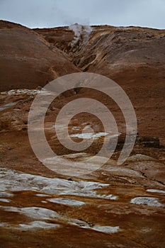 Red clay hill in the geothermal area Hverir, Iceland in summer. Myvatn region, North part of Iceland