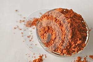 Red clay powder Montmorillonite in bowl isolated