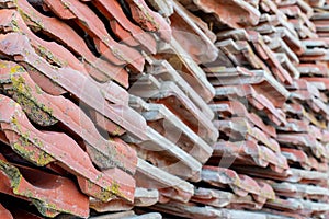 Red clay roof tile put in the stack after old tenement renovation