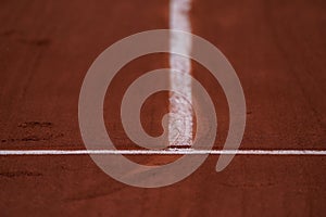 Red clay tennis court ready for play