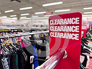Red clearance sales sign at department store