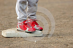 Red Cleats on Base