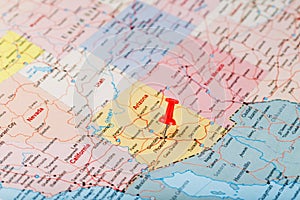 Red clerical needle on a map of the USA, Arizona and the capital Phoenix. Close up map of orizona with red tack