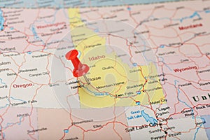 Red clerical needle on a map of USA, Idaho and the capital Boise. Closeup Map Idaho with Red Tack