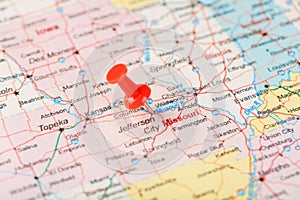 Red clerical needle on a map of USA, Missouri and the capital Jefferson City. Close up map of Missouri with red tack