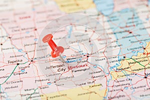 Red clerical needle on a map of USA, Missouri and the capital Jefferson City. Close up map of Missouri with red tack