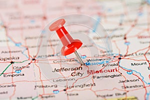 Red clerical needle on a map of USA, Missouri and the capital Jefferson City. Close up map of Missouri with red tack