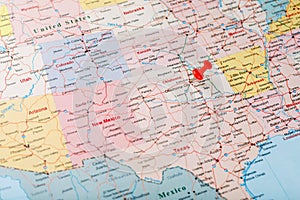 Red clerical needle on a map of the USA, Oklahoma and the Capital of Oklahoma City. Close up map of Oklahoma with red tack