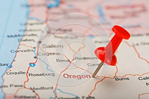 Red clerical needle on a map of USA, Oregon and the capital Salem. Closeup Map Oregon with Red Tack