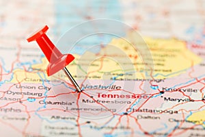 Red clerical needle on a map of USA, South Tennessee and the capital Nashville. Close up map of South Tennessee with red tack