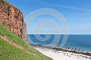 Red cliffs and beach at German island Helgoland