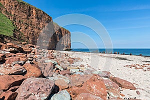 Red cliffs and beach at German island Helgoland