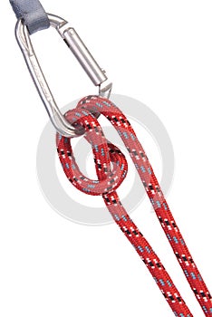 a red climbing rope knotted on a carabiner