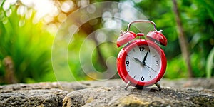 Red clock stand on the stone