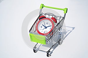 Red clock on the shopping cart, lack of time, waste of time, purchasing time.