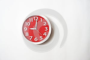 The red clock shows 9 o`clock.
