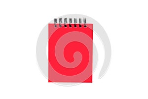 Red closed paper notepad with ring binder isolated on white back